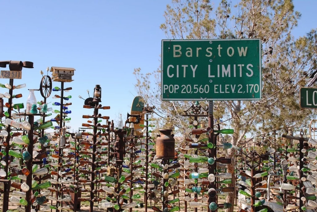 Barstow California city limit sign with bottles in the background