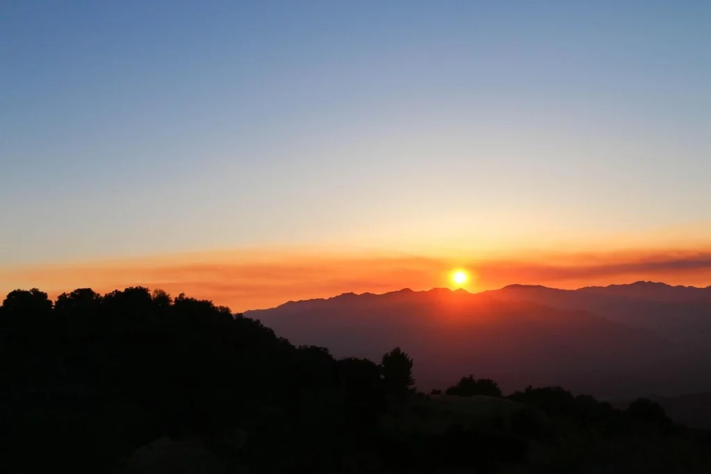 Soft orange and red sunset over the hills of Ojai, California