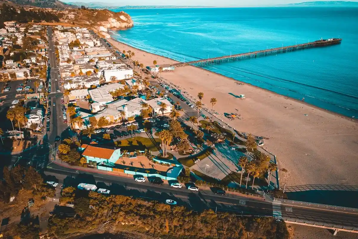 Aerial view of Avila Beach with the pier jutting out into the Pacific Ocean