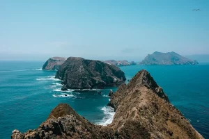 Large rocky islands with deep blue green water around them