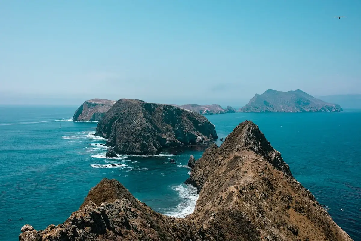 Large rocky islands with deep blue green water around them