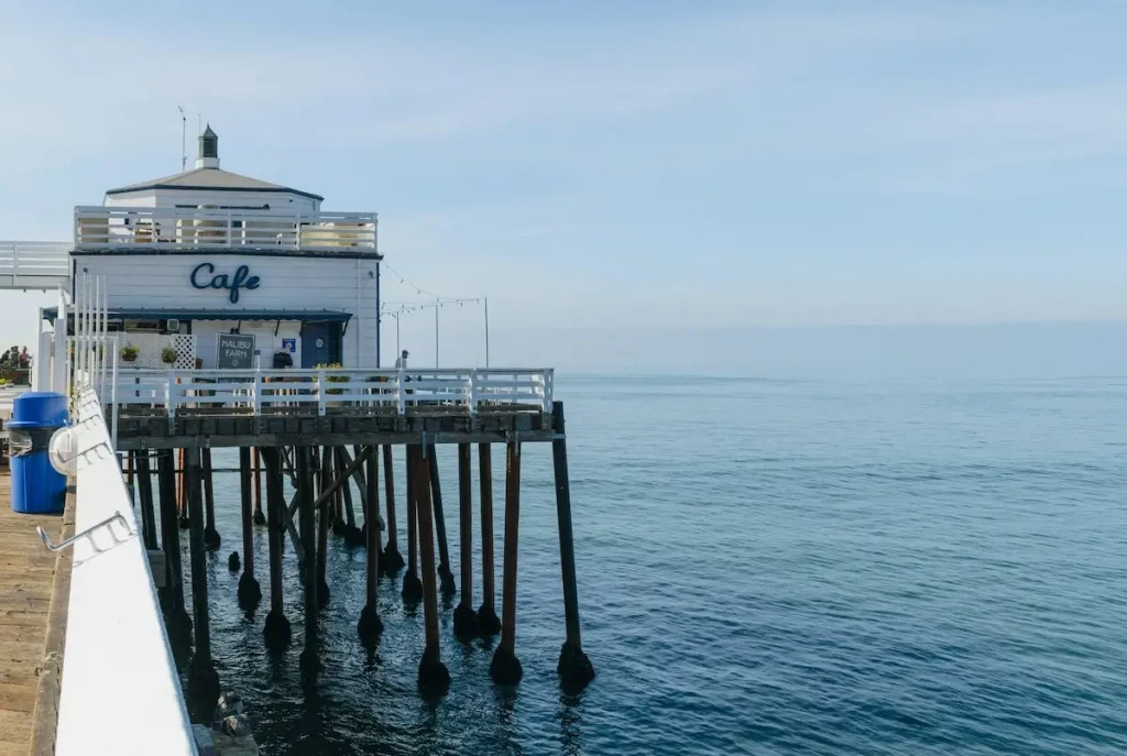 A white cafe perched on a pier in Malibu, California