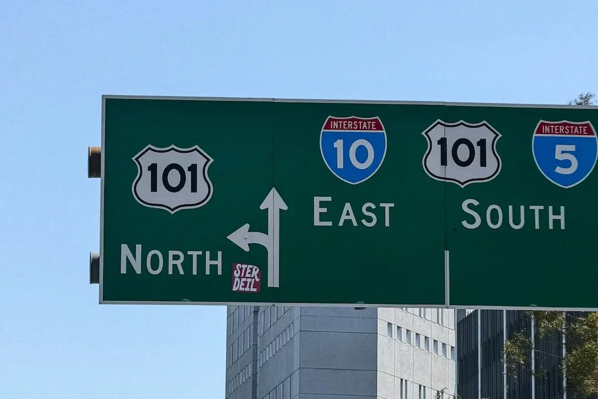 Highway road sign with southern California roads listed